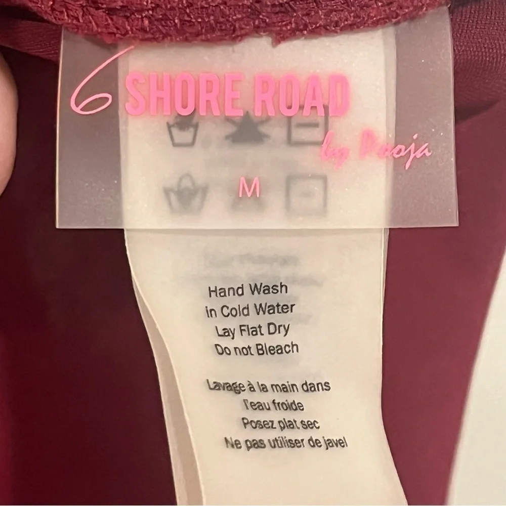 6 Shore Road maroon one piece with cut out and tie neck size medium